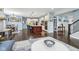 Open-concept living room features hardwood floors, modern decor, and a spacious layout perfect for entertaining at 7501 Independence Dr, Zionsville, IN 46077
