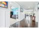 View of living spaces featuring hardwood floors, a leather couch, and a bright color palette at 7501 Independence Dr, Zionsville, IN 46077