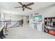 Loft area with stylish decor and a ceiling fan at 7501 Independence Dr, Zionsville, IN 46077