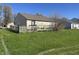 Expansive backyard with a wooden fence and a small deck at 7675 Mistflower Ln, Noblesville, IN 46062