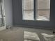 Sunlit bedroom with carpeted floors at 7675 Mistflower Ln, Noblesville, IN 46062