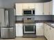 Updated kitchen featuring stainless steel appliances and white cabinets at 7675 Mistflower Ln, Noblesville, IN 46062