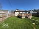 Spacious backyard with a wooden deck, perfect for outdoor entertaining and relaxation at 833 W Franklin St, Shelbyville, IN 46176