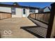 Spacious wooden deck with railing, perfect for relaxing and enjoying the outdoors at 833 W Franklin St, Shelbyville, IN 46176
