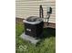 View of air conditioning unit on well maintained yard with green grass at 833 W Franklin St, Shelbyville, IN 46176