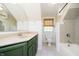 Bathroom featuring a bathtub, toilet, vanity, and window at 908 N Bolton Ave, Indianapolis, IN 46219