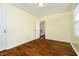 Inviting bedroom with natural light with pristine wood floors at 908 N Bolton Ave, Indianapolis, IN 46219