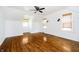 Spacious bedroom with hardwood floors, neutral tones, and great natural light at 908 N Bolton Ave, Indianapolis, IN 46219