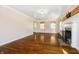 Spacious living room with hardwood floors, fireplace, and neutral wall color at 908 N Bolton Ave, Indianapolis, IN 46219