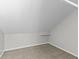 Unfinished attic space with carpet floors; great for storage or creative use at 914 N Bancroft St, Indianapolis, IN 46201