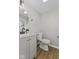 Well-lit bathroom featuring a modern vanity and toilet with a minimalist design at 914 N Bancroft St, Indianapolis, IN 46201