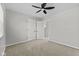 Spacious carpeted bedroom features a ceiling fan and a walk in closet at 914 N Bancroft St, Indianapolis, IN 46201