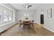Dining room with wood floors, ceiling fan, modern decor and plenty of natural light at 914 N Bancroft St, Indianapolis, IN 46201