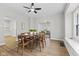 Dining room with wood floors, ceiling fan, modern decor and plenty of natural light at 914 N Bancroft St, Indianapolis, IN 46201