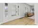 Bright foyer featuring wood floors, a decorative glass front door, and a view into the living room at 914 N Bancroft St, Indianapolis, IN 46201