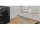 Beautiful kitchen featuring white cabinets, butcher block counters, and modern appliances at 914 N Bancroft St, Indianapolis, IN 46201