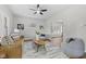 Cozy living room with wood floors, ceiling fan, comfortable seating, and an archway leading to the dining area at 914 N Bancroft St, Indianapolis, IN 46201