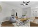 Spacious living room with hardwood floors, neutral paint, ceiling fan and plenty of natural light at 914 N Bancroft St, Indianapolis, IN 46201