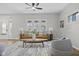 Bright living room with wood floors, ceiling fan, modern decor and comfortable seating, offering a relaxing atmosphere at 914 N Bancroft St, Indianapolis, IN 46201