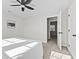 Well-lit main bedroom with walk-in closet and neutral carpet floors at 914 N Bancroft St, Indianapolis, IN 46201