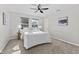 Comfortable main bedroom with natural light from the windows and neutral decor at 914 N Bancroft St, Indianapolis, IN 46201
