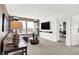 Comfortable living area with modern decor, plush seating, a flat-screen TV, and an open doorway at 965 Penrose Pl, Danville, IN 46122