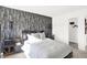 Stylish main bedroom has a decorative accent wall and en-suite bathroom with walk-in closet at 965 Penrose Pl, Danville, IN 46122