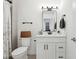 Bathroom showcasing a vanity with black hardware and a shower with decorative curtain at 9725 Thorne Cliff Way # 105, Fishers, IN 46037