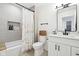 Modern bathroom features a shower with a built-in niche and a vanity with sleek hardware at 9725 Thorne Cliff Way # 105, Fishers, IN 46037