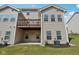 Exterior view showcasing a deck, a walk-out patio, and well-maintained landscaping at 9725 Thorne Cliff Way # 105, Fishers, IN 46037