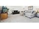 Comfortable living room with plush carpeting, two sofas, a TV, and a coffee table at 9725 Thorne Cliff Way # 105, Fishers, IN 46037
