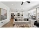 Bright and airy living room featuring an open layout to the kitchen and dining area at 9725 Thorne Cliff Way # 105, Fishers, IN 46037