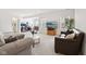 Cozy living room featuring two sofas, a TV, and an open floor plan to the office at 9725 Thorne Cliff Way # 105, Fishers, IN 46037