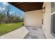 Covered patio offering a tranquil outdoor space with a view of the lawn and trees at 9725 Thorne Cliff Way # 105, Fishers, IN 46037
