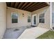 Covered patio with convenient access to the home, offering a comfortable outdoor living space at 9725 Thorne Cliff Way # 105, Fishers, IN 46037