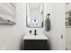 Compact powder room with a modern vanity, framed mirror, and neutral color palette at 9725 Thorne Cliff Way # 105, Fishers, IN 46037