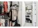 A walk-in closet providing ample storage space with clothing racks and shelves at 9725 Thorne Cliff Way # 105, Fishers, IN 46037