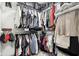 A walk-in closet providing ample storage space with clothing racks and shelves at 9725 Thorne Cliff Way # 105, Fishers, IN 46037