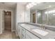 Elegant bathroom featuring a double vanity, sleek countertops, and a glass-enclosed shower for a spa-like experience at 9800 Ridgecrest Ln, McCordsville, IN 46055