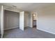 A serene bedroom with neutral walls and carpet with an open closet and bathroom at 9800 Ridgecrest Ln, McCordsville, IN 46055