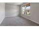 Bright bedroom features two windows that look out onto the neighborhood at 9800 Ridgecrest Ln, McCordsville, IN 46055
