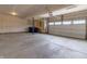 Spacious two-car garage with concrete floors, window, and ample storage space at 9800 Ridgecrest Ln, McCordsville, IN 46055