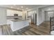 Gourmet kitchen with white cabinets, large island, and stainless steel appliances at 9800 Ridgecrest Ln, McCordsville, IN 46055