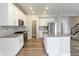 Beautiful kitchen features an island, stainless steel appliances, and ample cabinet space at 9800 Ridgecrest Ln, McCordsville, IN 46055