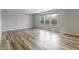 Spacious living room with large windows, providing plenty of natural light at 9800 Ridgecrest Ln, McCordsville, IN 46055