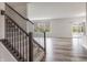View of the living room with bright windows and a staircase at 9800 Ridgecrest Ln, McCordsville, IN 46055