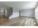 Open living room featuring a staircase and large windows, perfect for relaxation at 9800 Ridgecrest Ln, McCordsville, IN 46055