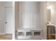 Convenient mudroom area with built-in bench and storage cubbies, plus a nearby half bath at 9800 Ridgecrest Ln, McCordsville, IN 46055