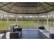 Beautiful sunroom featuring wicker furniture and abundant natural light at 9800 Ridgecrest Ln, McCordsville, IN 46055