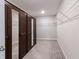 Walk-in closet featuring ample shelving, a mirrored closet door, and generous storage space for organized living at 9800 Ridgecrest Ln, McCordsville, IN 46055